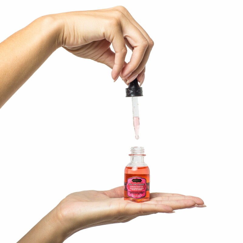 Масло для поцілунків їстівне з розігрівом Kama Sutra OIL OF LOVE the Original 22 ML